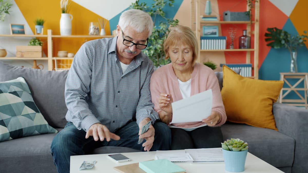 A couple reviewing paperwork at home