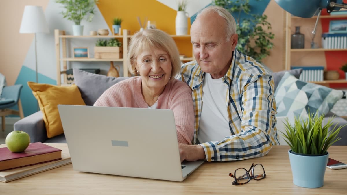 A couple looking at a laptop together